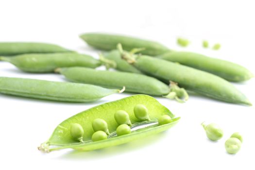 Fresh peas on white background