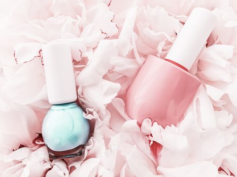 Nail polish bottles on floral background, french manicure and cosmetic branding design