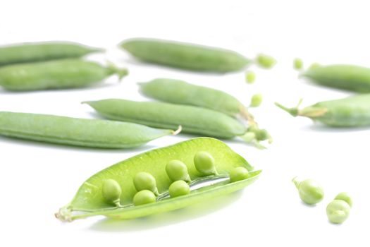 Fresh peas on white background