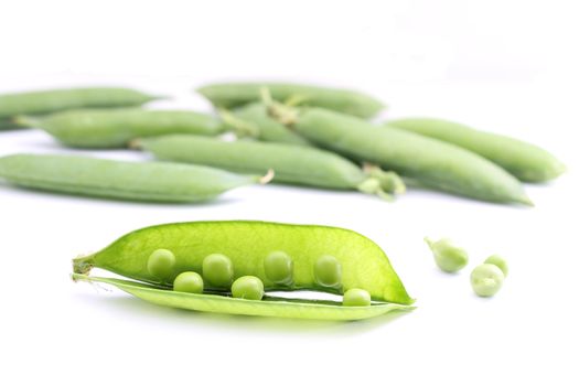 Fresh peas on white background