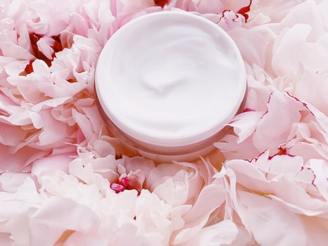 Face cream moisturizer on floral background as luxury skincare cosmetics, healthcare and beauty product concept