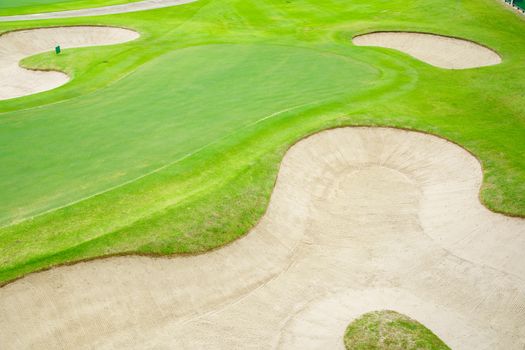 Top view golf court,  beautiful Bunkers sand, putting green and green nature grass, Fairway Rough.