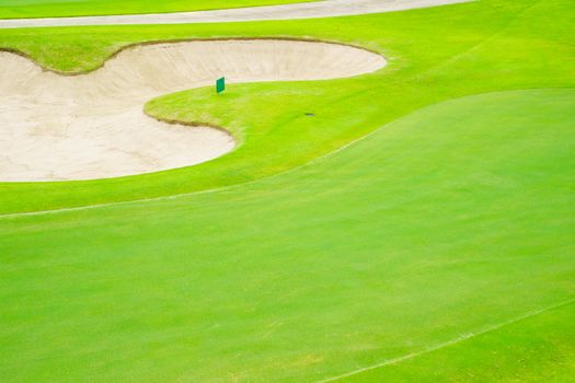 Top view golf court,  beautiful Bunkers sand, putting green and green nature grass, Fairway Rough.