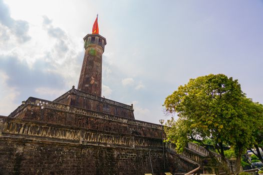 Flag of Vietnam on old tower in Vietnam Military History Museum and OLD QUARTER CITY in HANOI VIETNAM