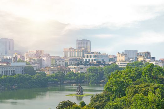 OLD QUARTER, HANOI/VIETNAM Landmark in city and top view of The Huc bridge and Ngoc Son temple or pagoda good culture. Lake of the Returned Sword, Hoan Kiem Lake in the morning time the sunset.