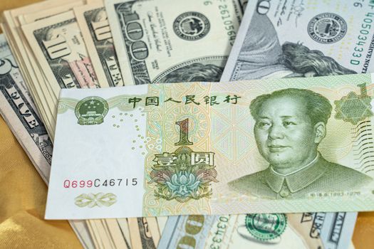 Money in China CNY, Pay, exchange money People’s Republic of China (PRC) yuan and money in us dollar USD, Pay, on yellow background.