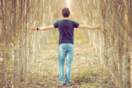 young man on a walk through nature, balanced thoughts and relaxation.