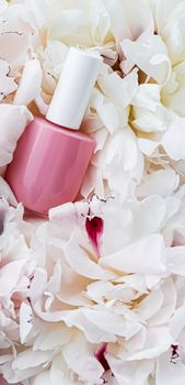 Nail polish bottles on floral background, french manicure and cosmetic branding design