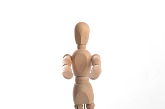 Wooden figure mannequin posing in action isolated on white background.