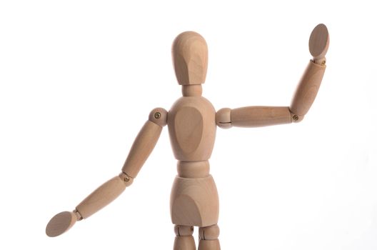 Wooden figure mannequin posing in action isolated on white background.