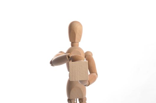 Wooden figure mannequin posing in action isolated on white background.