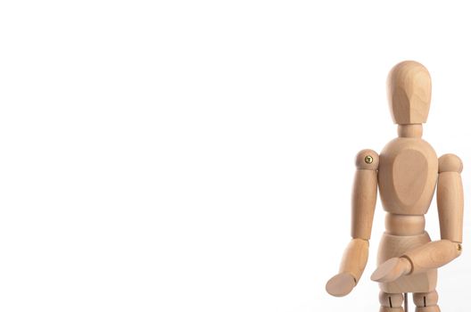 Wooden figure mannequin posing in action isolated on white background.