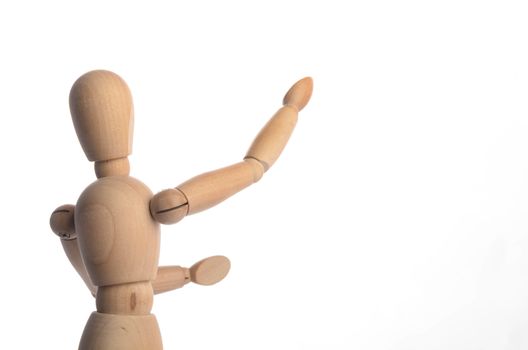 Wooden figure mannequin posing in action isolated on white background.