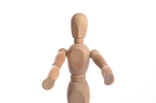 Wooden figure mannequin posing in action isolated on white background.