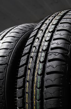 Protector of automobile tires. A number of automobile tires. Close up view on auto mobile new wheel tire surface. Different pattern and type tires for car industry commercial transport transpotration