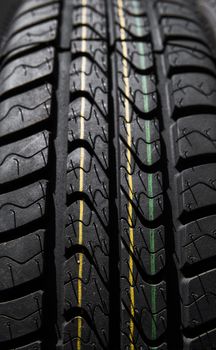 Protector of automobile tires. Close up view on auto mobile new wheel tire surface. Car constraction industry commercial transport transpotration