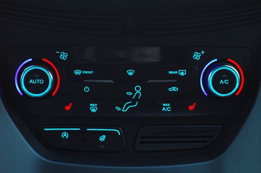 manual switches the air conditioning on the dashboard of the car