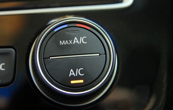 manual switches the air conditioning on the dashboard of the car