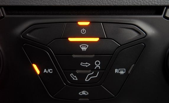 manual switches the air conditioning on the dashboard of the car