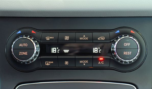 manual switches the air conditioning on the dashboard of the car