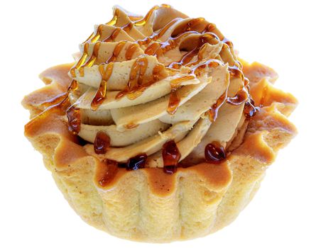 Tartlet cake with cream and caramel isolated on a white background.