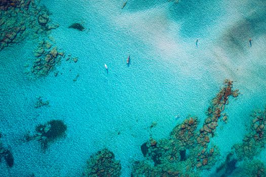 Aerial view of beautiful tropical Elafonissi Beach with pink sand. View of a nice tropical Elafonissi beach from the air. Beautiful sky, sea, resort. Elafonissi beach, Crete, Greece.