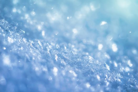 Macro background of fresh snow texture on a blur.