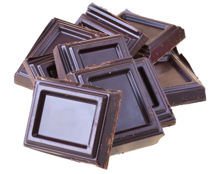 Tower cubes of chocolate close up isolated on white background.
