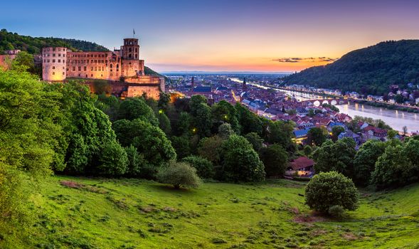 Panoramic view of beautiful medieval town Heidelberg including Carl Theodor Old Bridge, Neckar river, Church of the Holy Spirit, Germany