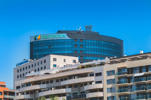 Valencia, Spain - June 17, 2017: Architectural detail of the Iberdrola tower in the city center on a summer day. A company specializing in the production and sale of electricity and natural gas