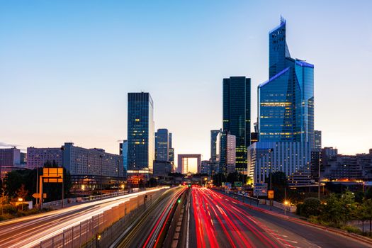 La Defense Financial District Paris France at sunset. Skyscrapers of Defense modern business and financial district in Paris with high-rise buildings and convention center. La Defense business area.