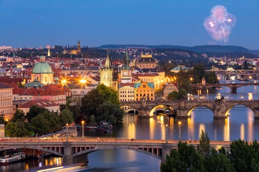 Prague, Czech Republic bridges panorama with historic Charles Bridge and Vltava river at night. Pargue at dusk, view of the Lesser Bridge Tower of Charles Bridge (Karluv Most). Czechia.