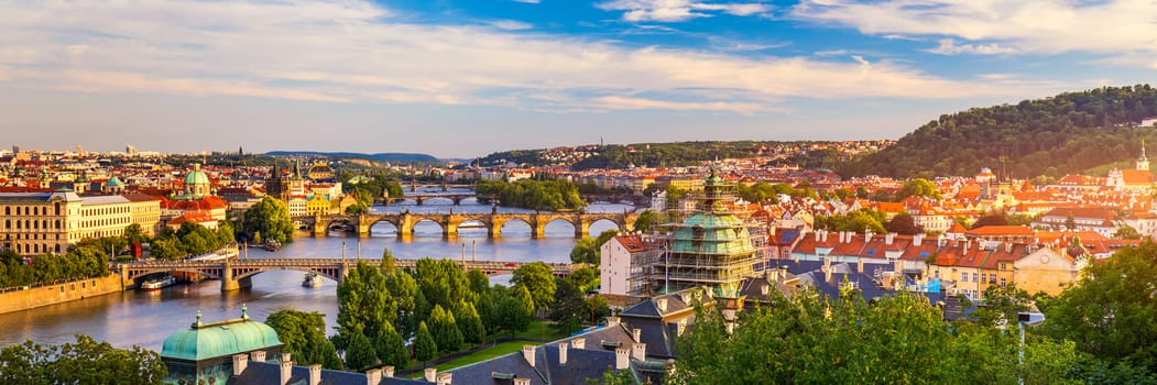 Scenic view on Vltava river and historical center of Prague, buildings and landmarks of old town, Prague, Czech Republic. Charles Bridge (Karluv Most) and Lesser Town Tower, Prague, Czechia