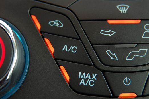 manual switches the air conditioning on the dashboard of the car