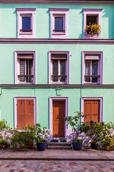 Cremieux Street (Rue Cremieux), Paris, France. Rue Cremieux in the 12th Arrondissement is one of the prettiest residential streets in Paris. Colored houses in Rue Cremieux street in Paris. France.