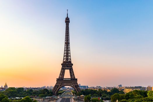 Eiffel tower in summer, Paris, France. Scenic panorama of the Eiffel tower under the blue sky. View of the Eiffel Tower in Paris, France in a beautiful summer day. Paris, France.