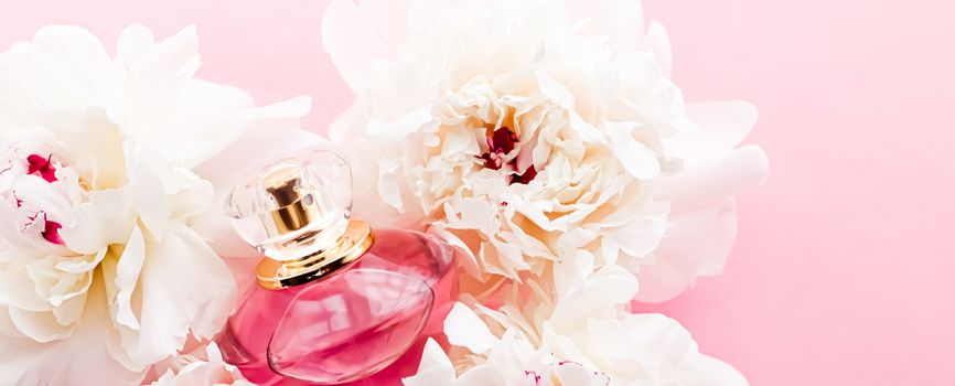 Luxurious fragrance bottle as chic perfume product on background of peony flowers, parfum ad and beauty branding design