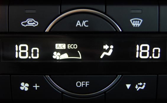 manual switches the air conditioning on the dashboard of the car