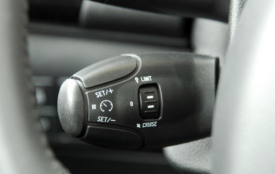 cruise control stick which is located behind the wheel