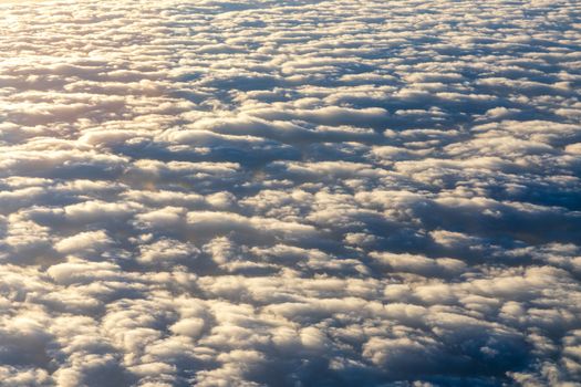 Blanket of clouds. Sun going below a blanket of clouds. On top of a blanket of clouds. Sun going below a blanket of clouds. Smooth view from above with a blanket of clouds.
