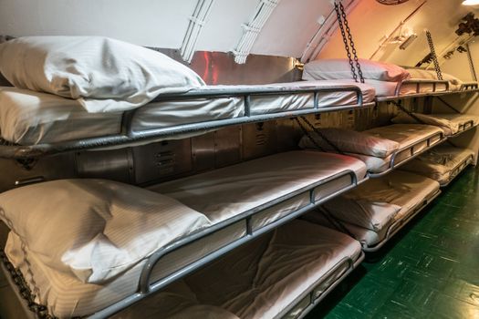 Oahu, Hawaii, USA. - January 10, 2020: Pearl Harbor. Sleeping quarter with hanging triple bunk beds in long submarine USS Bowfin.