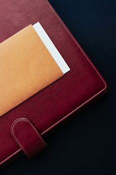 Office desk with briefcase and business card, finance and economy concept