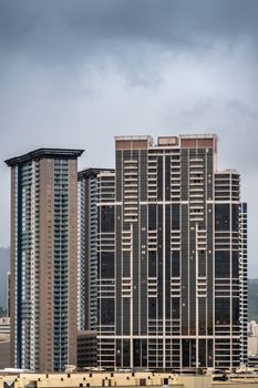 Honolulu  Oahu, Hawaii, USA. - January 11, 2020: Brown Keola Lai high rise building on 600 Queen street under gray cloudscape.