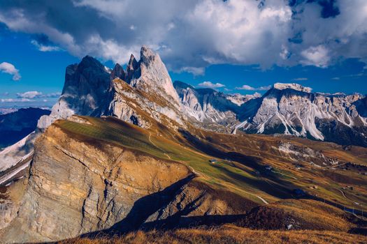Seceda in autumn in South Tyrol in the Alps of North Italy. Views from Seceda over the Odle mountains in autumn with fall colors. Seceda, Val Gardena, Trentino Alto Adige, South Tyrol in Italy.