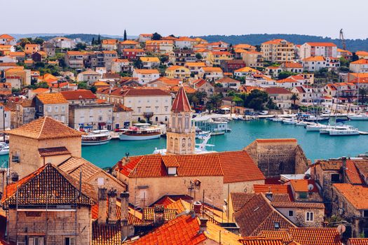 Trogir in Croatia, town panoramic view with red roof tiles, Croatian tourist destination. Trogir town sea front view, Croatia. Roofs of Trogir in Croatia.