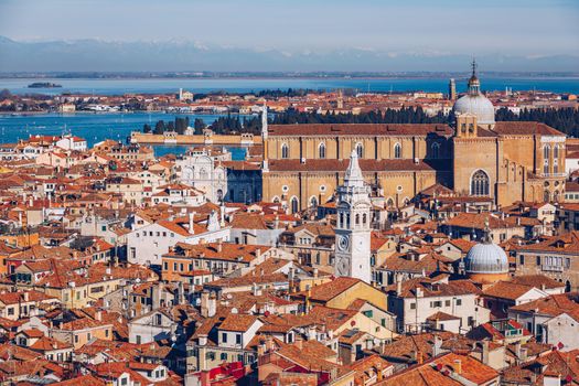 Venice panoramic aerial view with red roofs, Veneto, Italy. Aerial view with dense medieval red roofs of Venice, Italy 