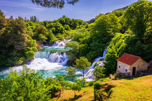 Waterfalls Krka, National Park, Dalmatia, Croatia. View of Krka National Park, Roski Slap location, Croatia, Europe. Beautiful world of Mediterranean countries. Traveling concept background.