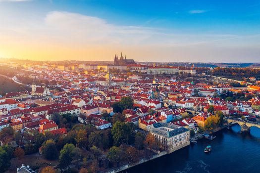 Aerial Prague panoramic drone view of the city of Prague at the Old Town Square, Czechia. Prague Old Town pier architecture and Charles Bridge over Vltava river in Prague at sunset, Czech Republic. 
