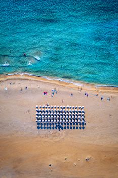 People swimming in the sea. Aerial view, Top view. The color of the water and beautifully bright. Swimming and relaxing in the sea blue lagoon aerial top view. Top view from flying drone.