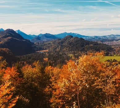 Beautiful nature of European Alps, landscape view of alpine mountains, lake and village in autumn season, travel and destination scenery